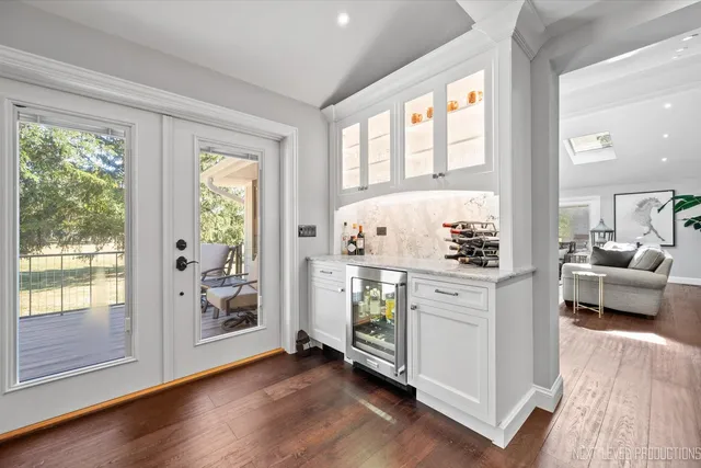 a view of kitchen with furniture and wooden floor