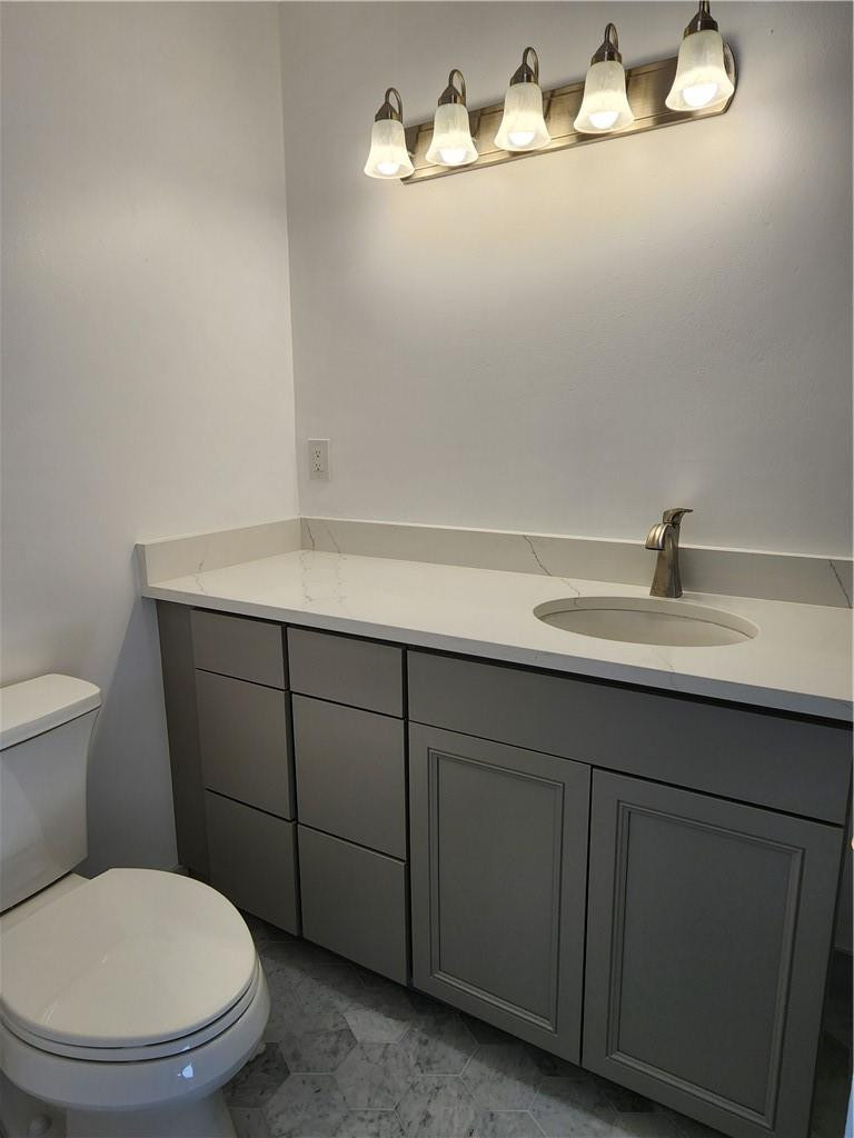 Undisclosed Address Pompano Beach, FL 33063 - Photo 11 of 30 a bathroom with a toilet and a sink