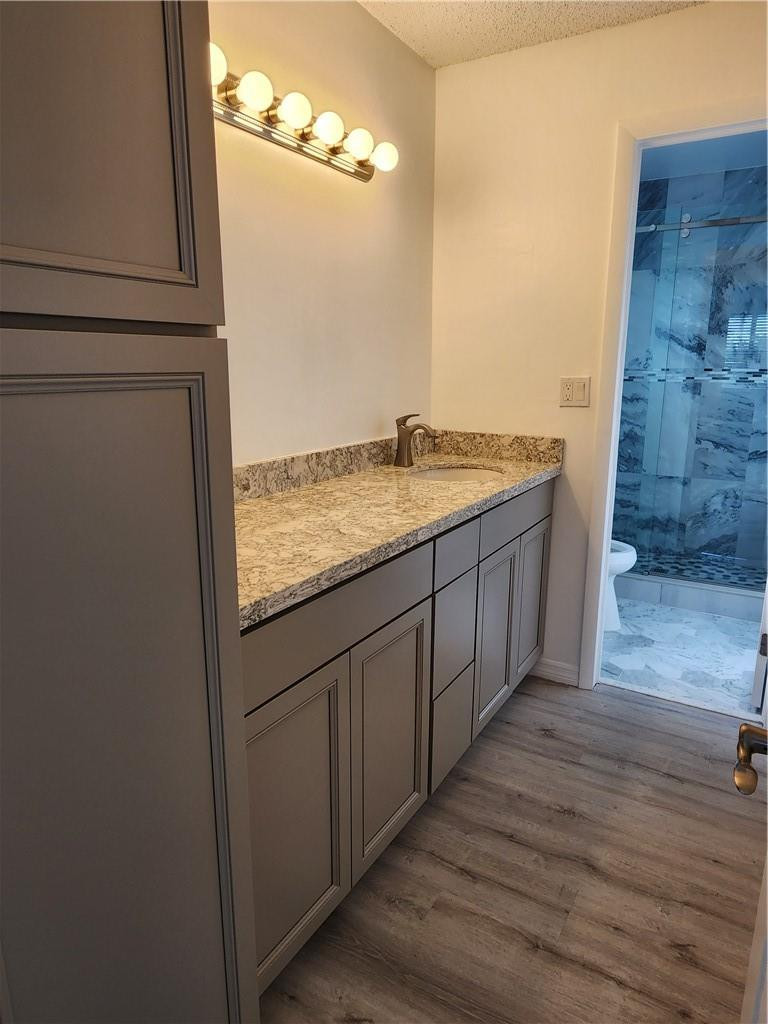 Undisclosed Address Pompano Beach, FL 33063 - Photo 20 of 30 a bathroom with a granite countertop sink and a mirror