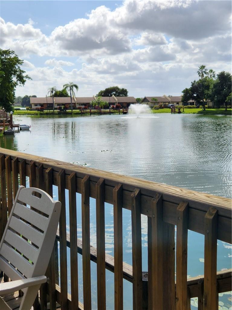 Undisclosed Address Pompano Beach, FL 33063 - Photo 26 of 30 a view of a lake with houses