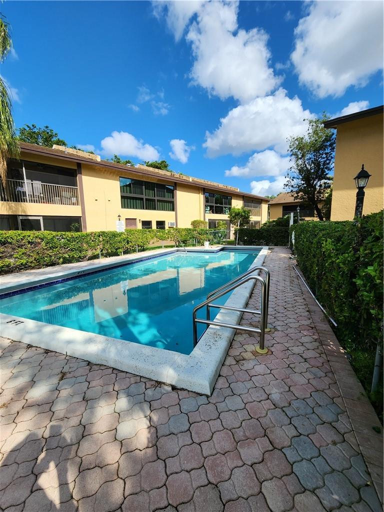 Undisclosed Address Pompano Beach, FL 33063 - Photo 29 of 30 a view of a house with a yard