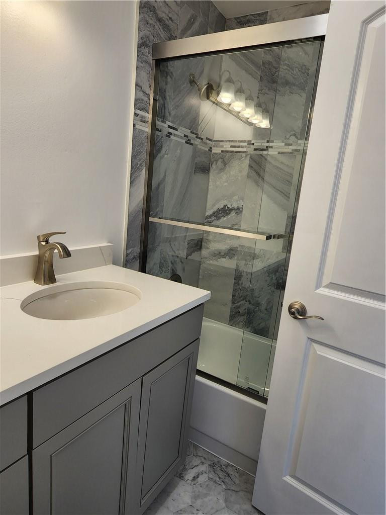 Undisclosed Address Pompano Beach, FL 33063 - Photo 10 of 30 a bathroom with a sink and mirror with bathtub