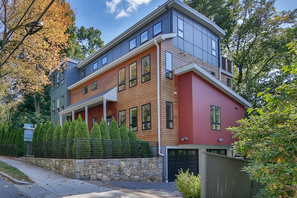 26 Beaconsfield Road, Unit 26 Brookline, MA 02445 - Photo 1 of 35 a front view of a house with a garden
