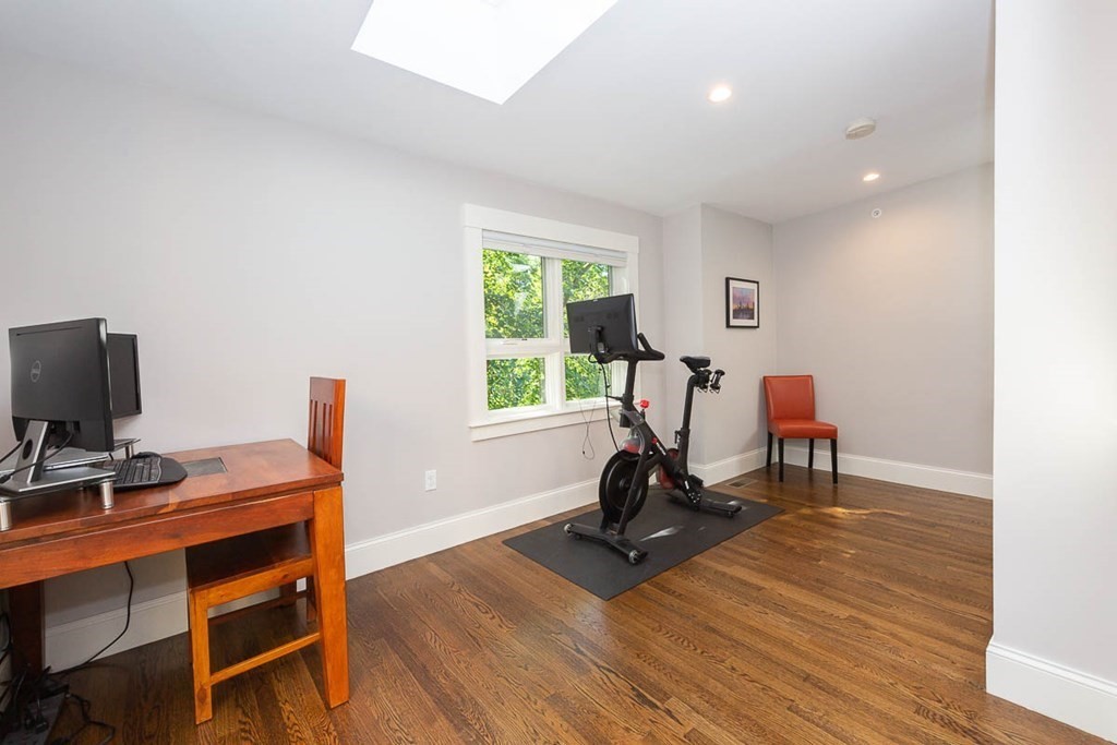 26 Beaconsfield Road, Unit 26 Brookline, MA 02445 - Photo 30 of 35 a view of a workspace with furniture and a window