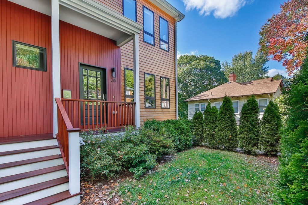 26 Beaconsfield Road, Unit 26 Brookline, MA 02445 - Photo 3 of 35 a view of a house with brick walls plants and large tree