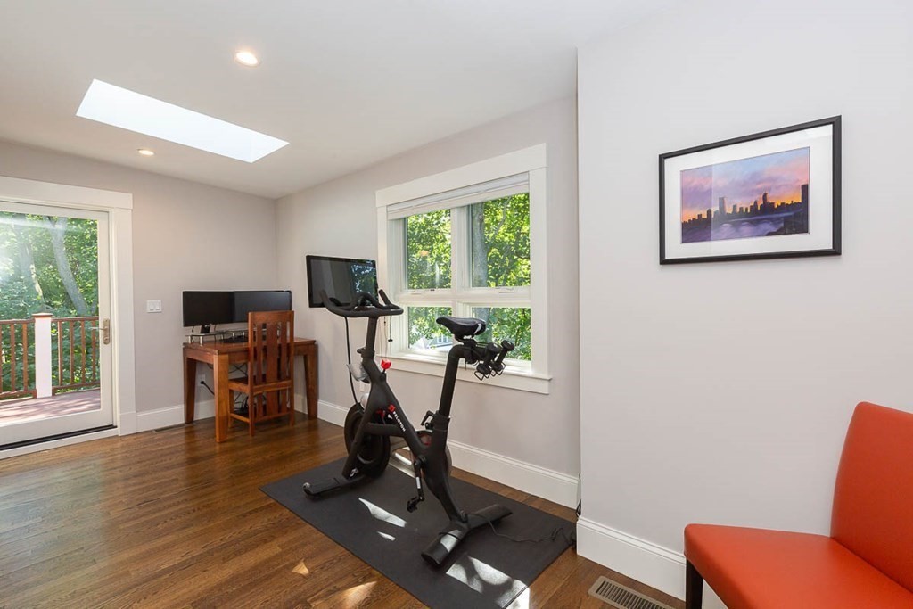 26 Beaconsfield Road, Unit 26 Brookline, MA 02445 - Photo 31 of 35 a view of a livingroom with furniture and a gym cycle