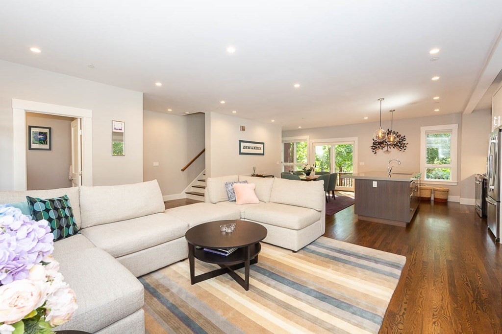 26 Beaconsfield Road, Unit 26 Brookline, MA 02445 - Photo 8 of 35 a living room with furniture and a wooden floor