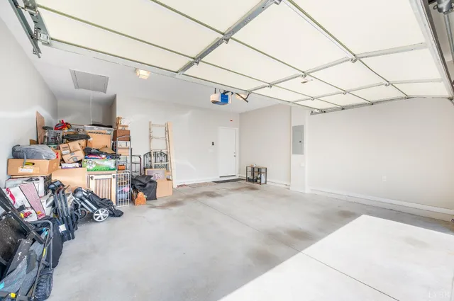 a living room with fireplace furniture and a large window