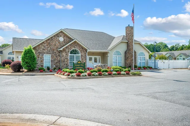 a living room with furniture and a book shelf