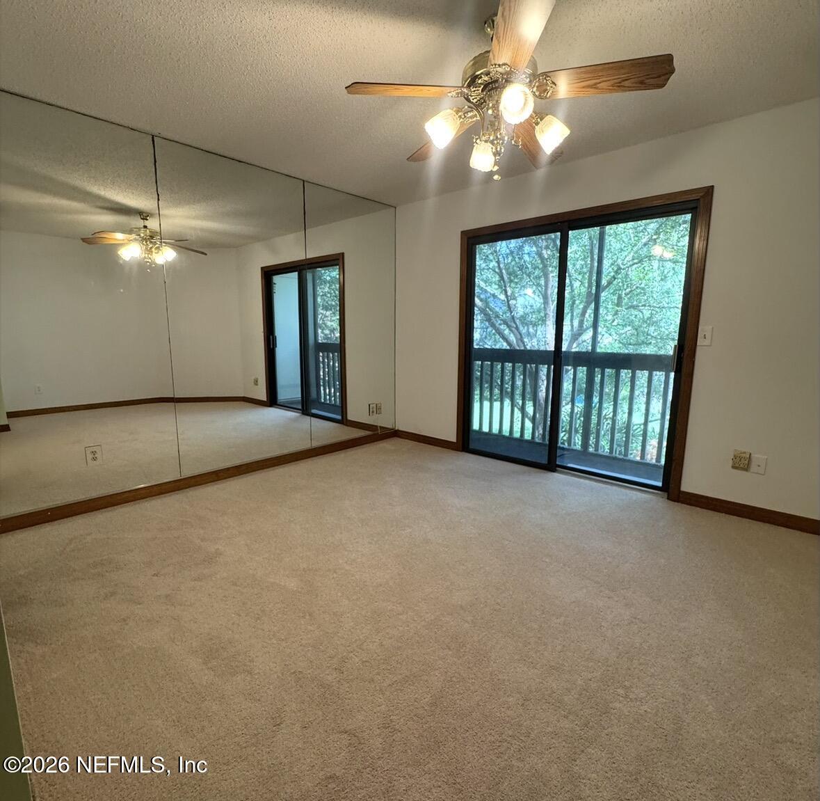 10800 Old St Augustine Road, Unit 204 Jacksonville, FL 32257 - Photo 23 of 31 Primary bedroom with balcony