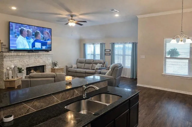 a living room with furniture and a fireplace