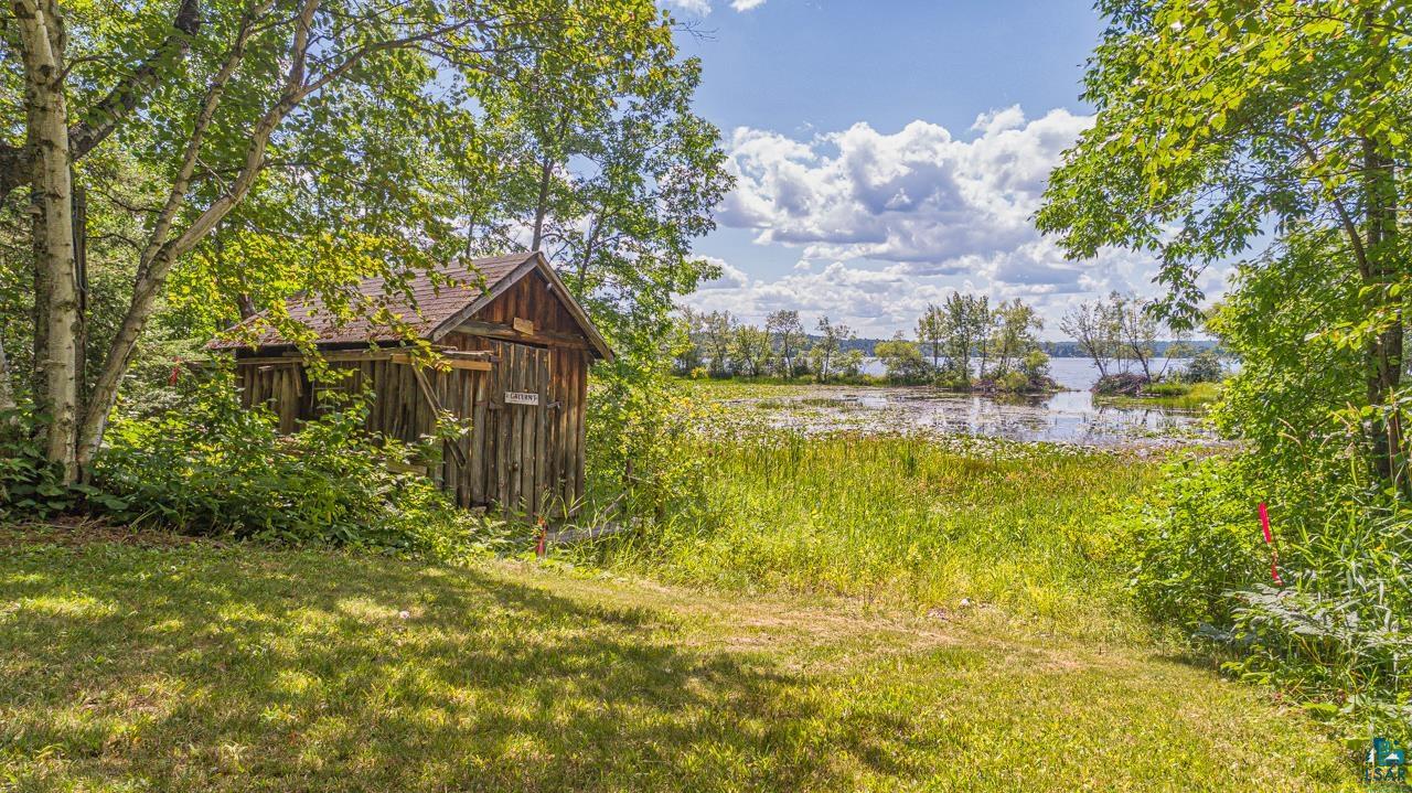 14057 Mikana Road Ely, MN 55731 - Photo 9 of 11 View of yard featuring a storage unit