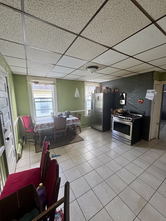57-59 Walnut Street Lawrence, MA 01841 - Photo 11 of 23 a living room with furniture and a flat screen tv