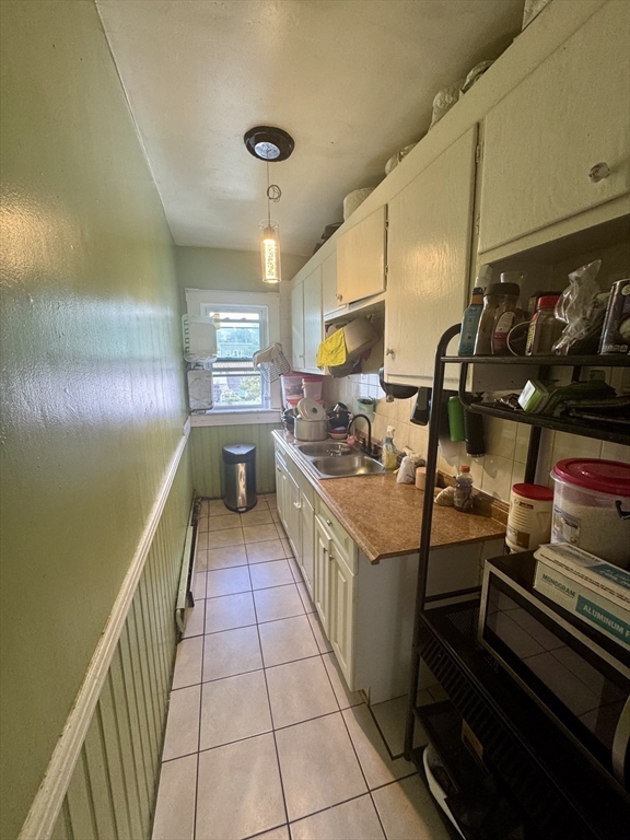 57-59 Walnut Street Lawrence, MA 01841 - Photo 14 of 23 a kitchen with stainless steel appliances granite countertop a sink and cabinets
