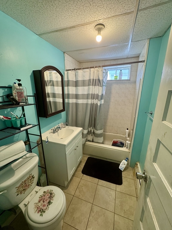 57-59 Walnut Street Lawrence, MA 01841 - Photo 15 of 23 a bathroom with a toilet a sink and a mirror