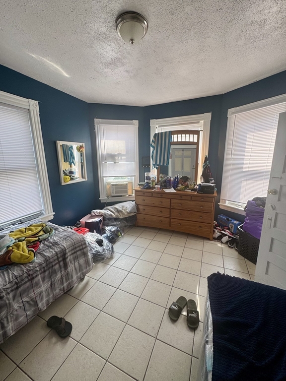 57-59 Walnut Street Lawrence, MA 01841 - Photo 16 of 23 a living room with furniture and a window