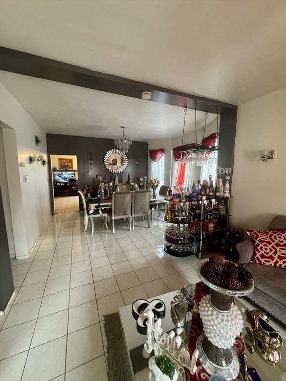 57-59 Walnut Street Lawrence, MA 01841 - Photo 5 of 23 a room with lots of chairs and musical instruments