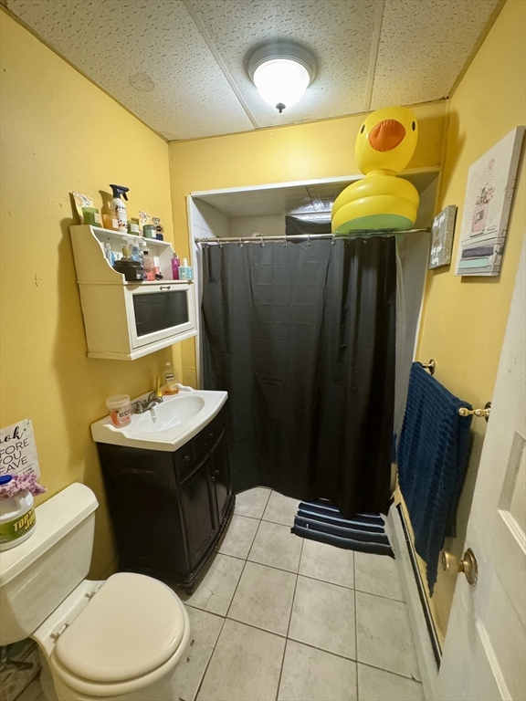 57-59 Walnut Street Lawrence, MA 01841 - Photo 10 of 23 a bathroom with a sink a toilet and shower
