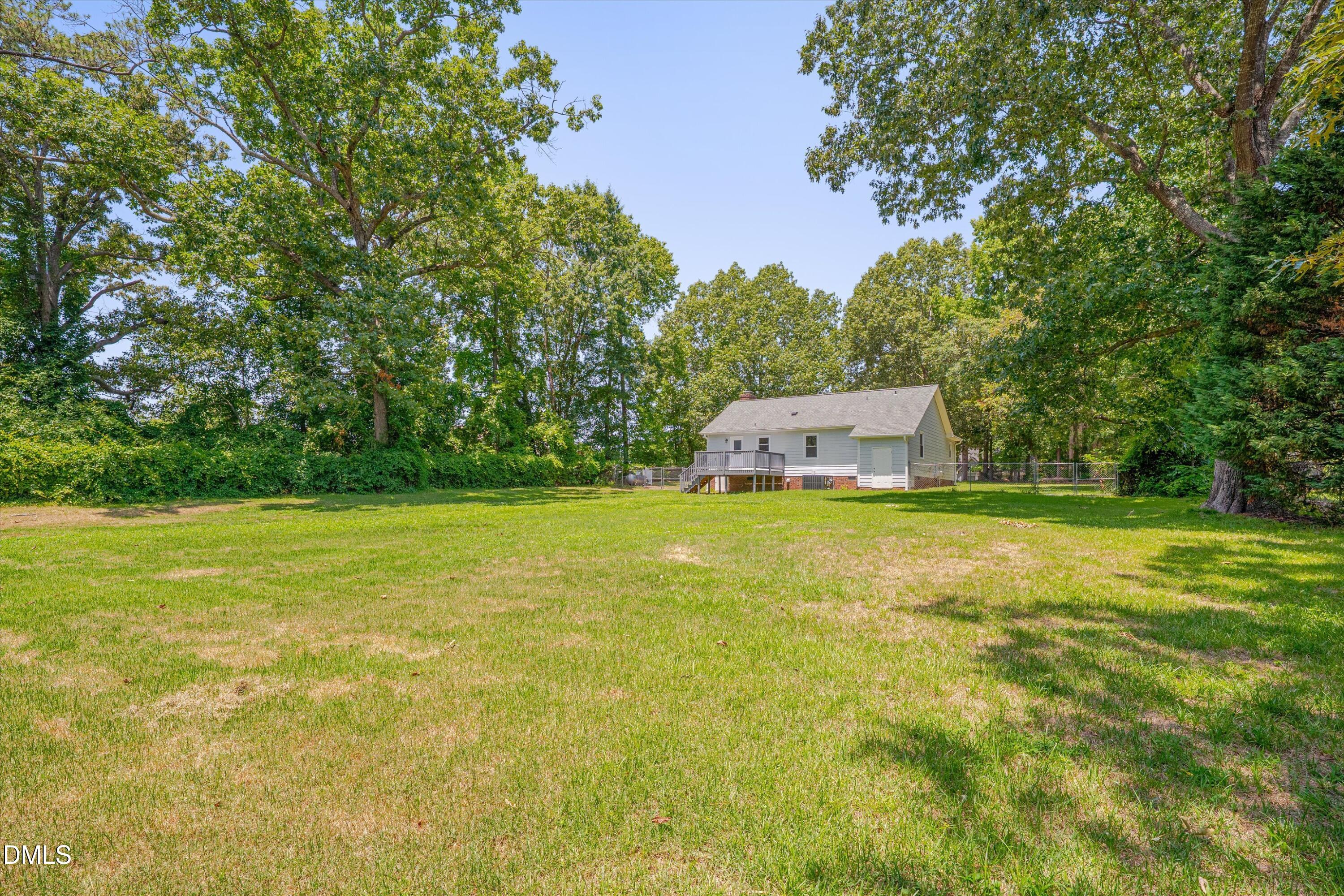 2677 North Shiloh Road Garner, NC 27529 - Photo 12 of 15 Rear view of house and fenced yard