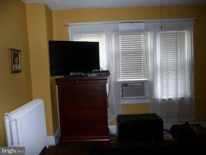6710 Beech Avenue Baltimore, MD 21206 - Photo 18 of 28 a living room with furniture and a flat screen tv