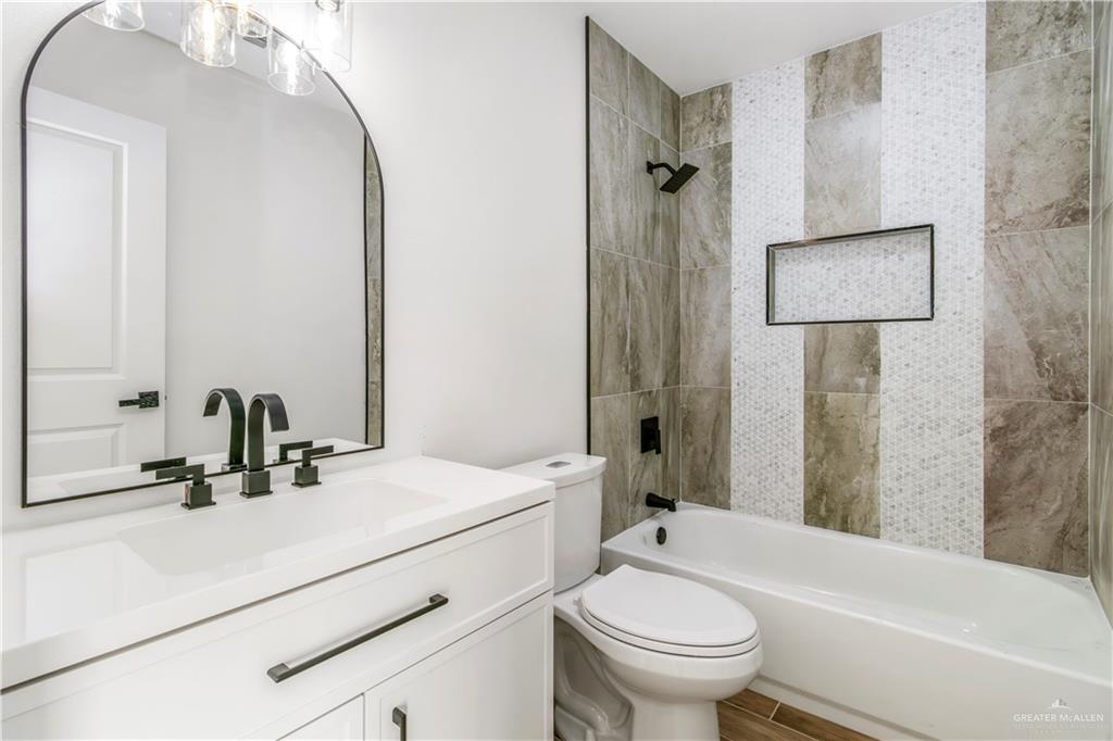 2309 Victoriano Street Weslaco, TX 78596 - Photo 14 of 15 a bathroom with a sink toilet and shower