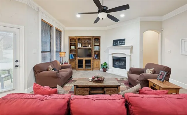 a living room with furniture fireplace and a flat screen tv
