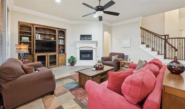 a living room with furniture fireplace and a flat screen tv