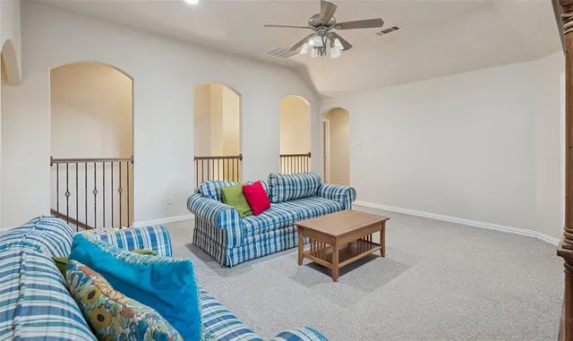 a living room with furniture and a rug