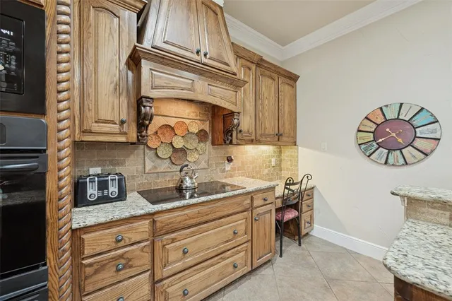 a kitchen with stainless steel appliances granite countertop a sink and cabinets