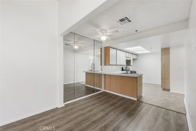 a large bathroom with a sink and a mirror