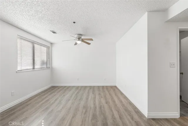 a view of room with hardwood floor and window