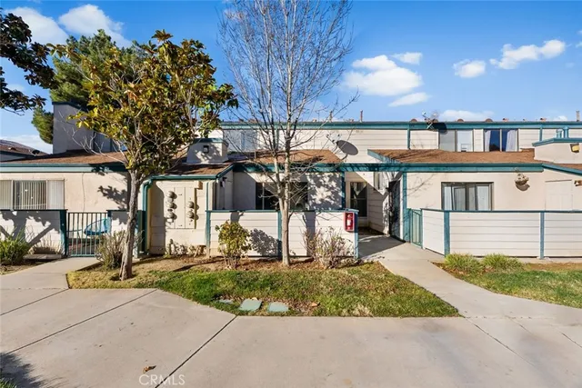 a view of a swimming pool with a yard