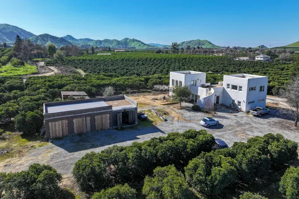 an aerial view of a house with a garden