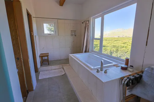 a view of a bedroom with a window