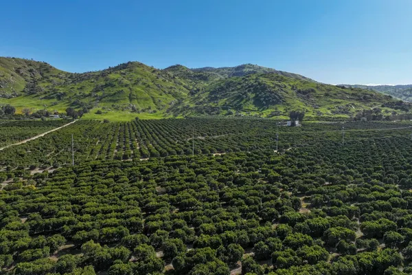 a view of a large mountain with mountains in the background