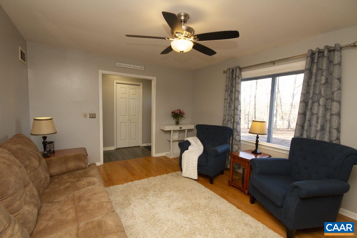 116 Tulip Road Ruckersville, VA 22968 - Photo 3 of 19 a bed room with a bed and a couch