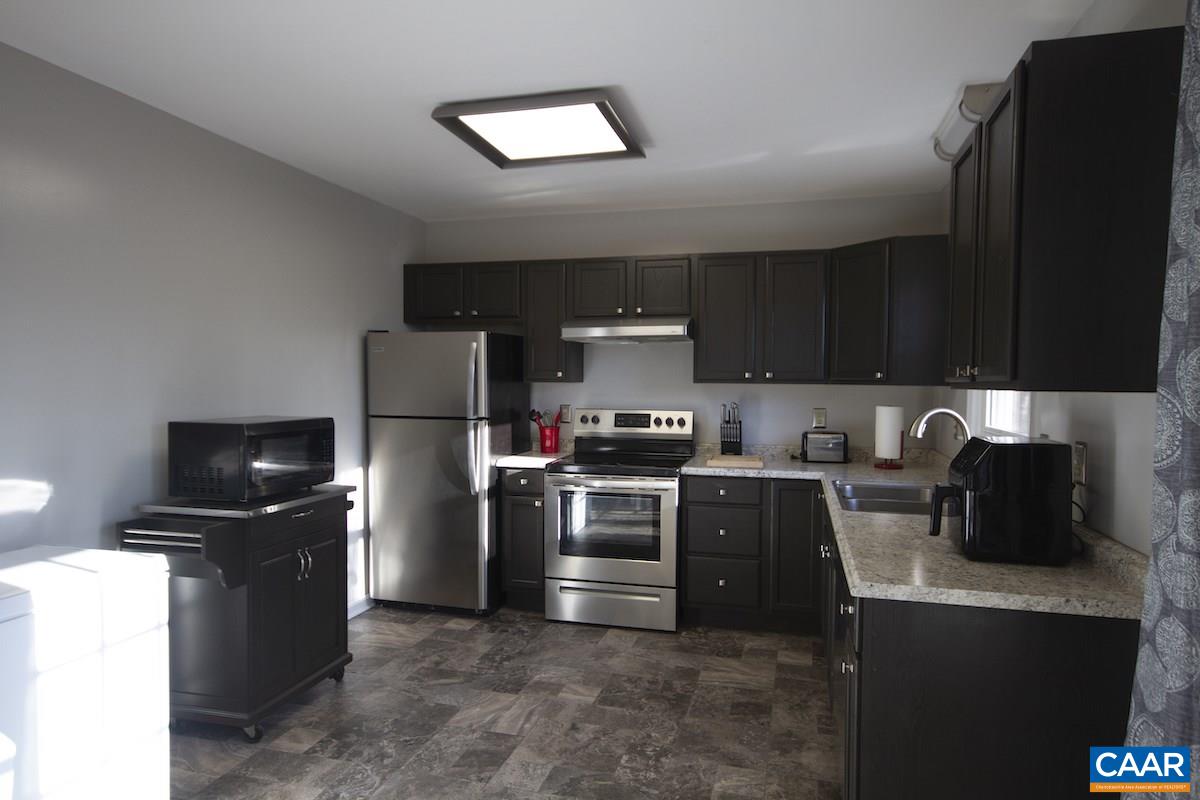 116 Tulip Road Ruckersville, VA 22968 - Photo 9 of 19 a kitchen with a sink and steel appliances