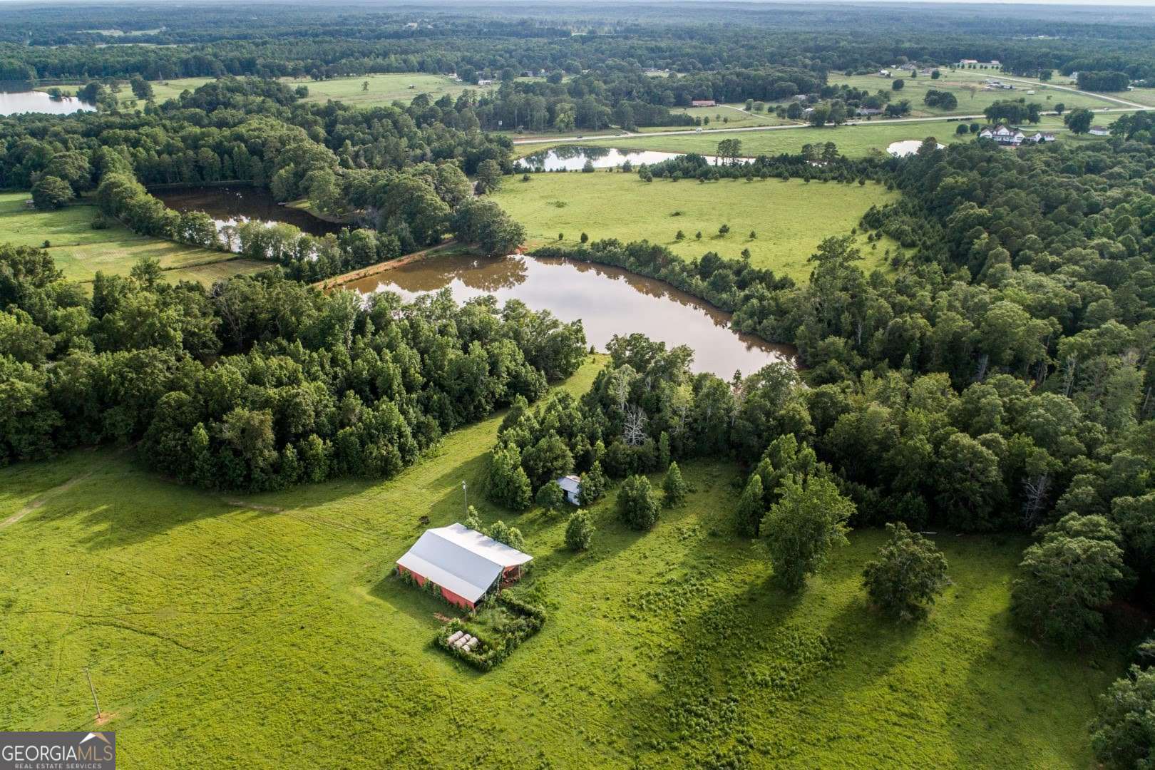 1530 State Highway 11 Covington, GA 30014 - Photo 21 of 32 a view of a lake with a yard