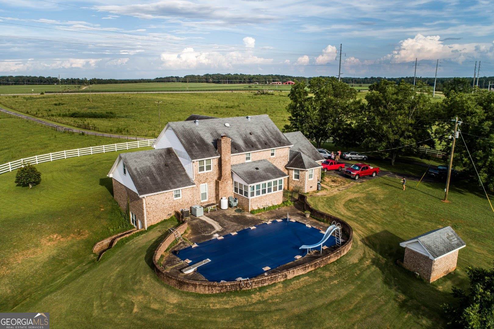 1530 State Highway 11 Covington, GA 30014 - Photo 22 of 32 an aerial view of a house with a yard basket ball court and outdoor seating