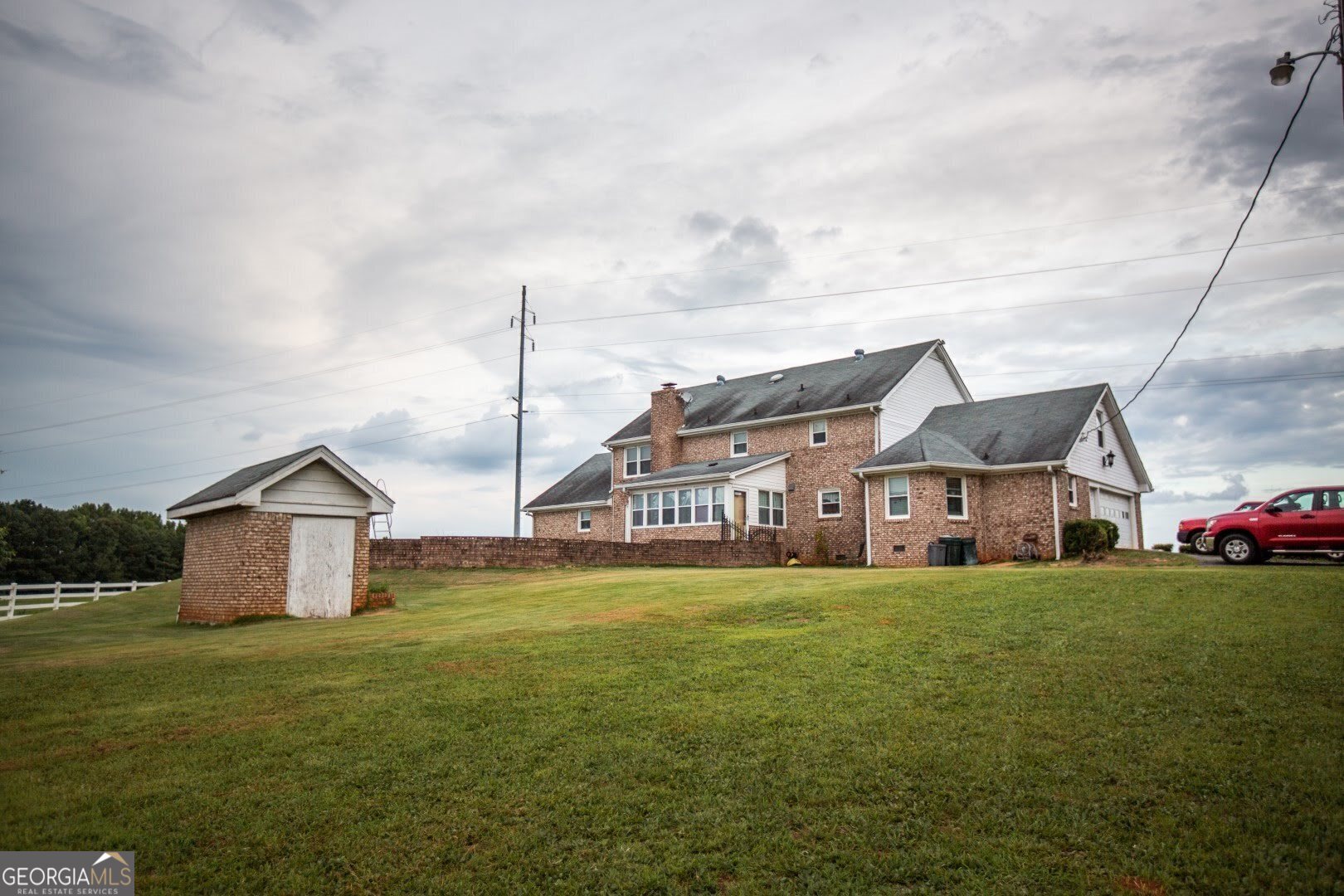 1530 State Highway 11 Covington, GA 30014 - Photo 23 of 32 a view of a house with a big yard and large trees