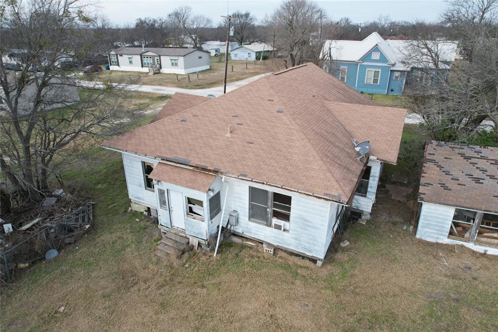 103 West 3rd Street Barry, TX 75102 - Photo 16 of 40 a aerial view of a house with a yard