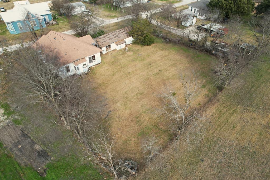 103 West 3rd Street Barry, TX 75102 - Photo 2 of 40 a view of a yard with trees