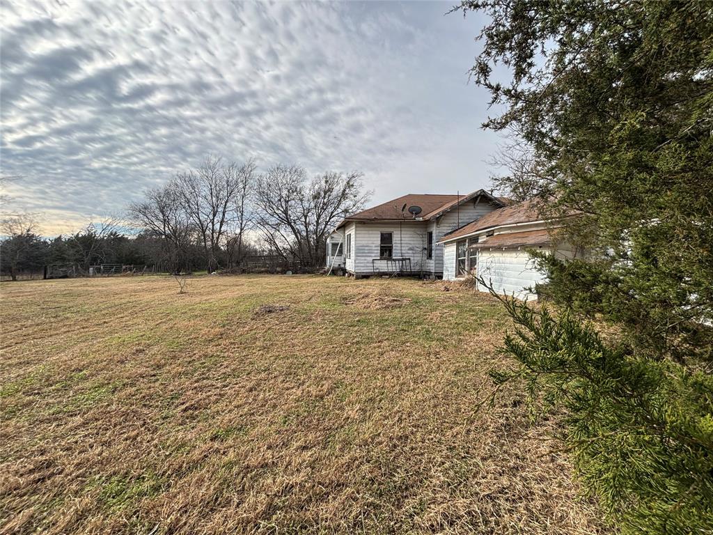 103 West 3rd Street Barry, TX 75102 - Photo 22 of 40 a view of a house with a yard