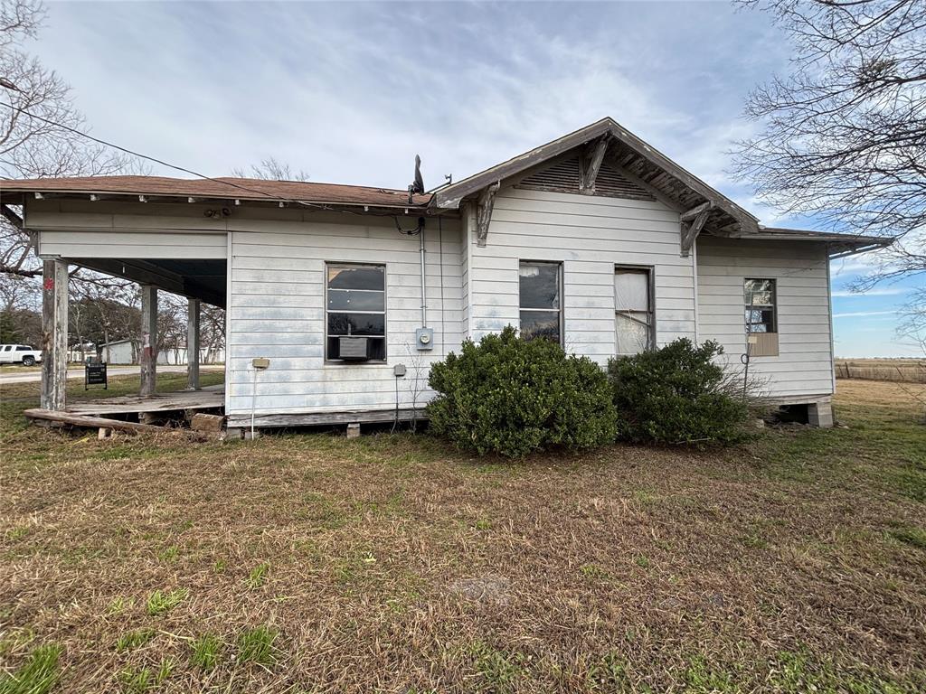 103 West 3rd Street Barry, TX 75102 - Photo 26 of 40 a view of a house with a yard