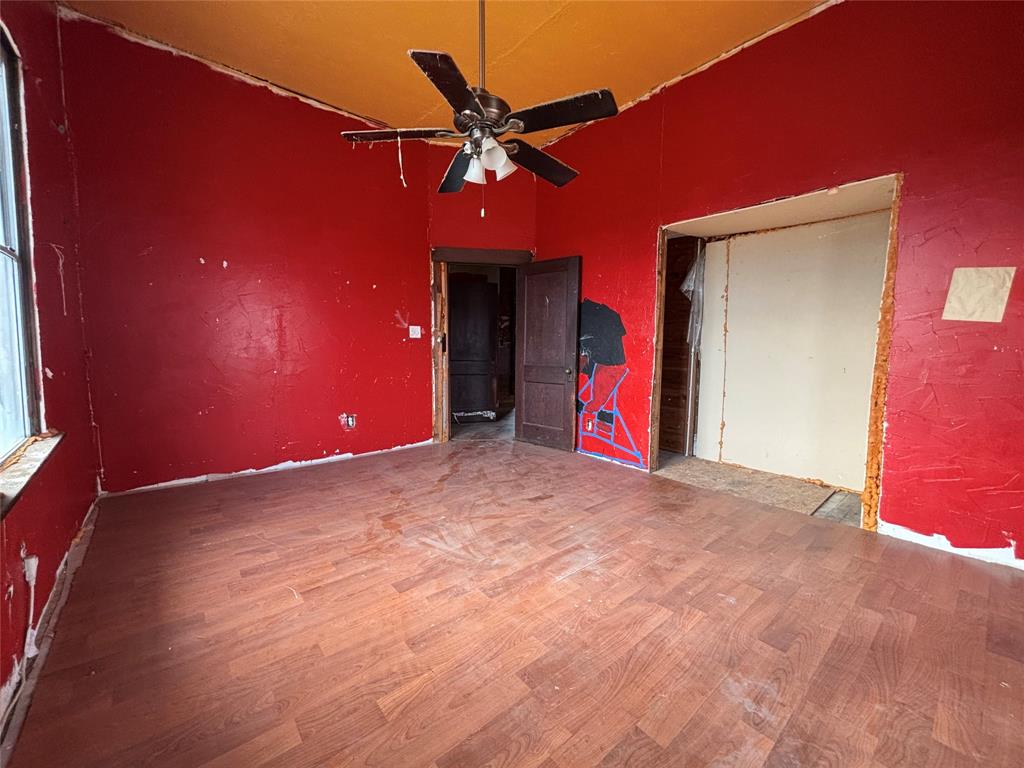 103 West 3rd Street Barry, TX 75102 - Photo 33 of 40 a view of a livingroom with a ceiling fan and window