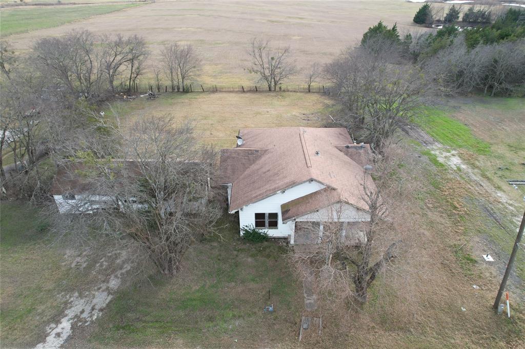 103 West 3rd Street Barry, TX 75102 - Photo 7 of 40 a view of a house with a yard