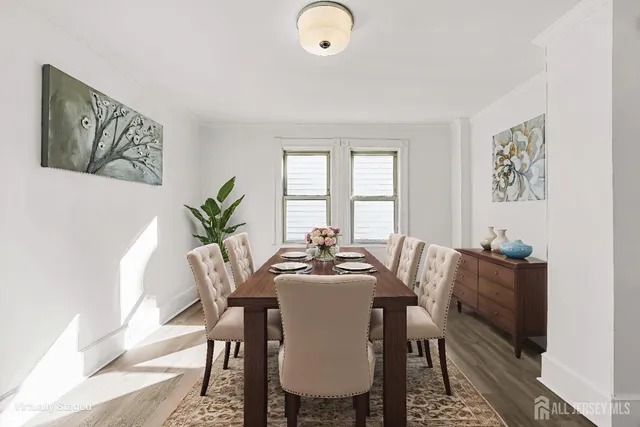 a dining room with furniture and window