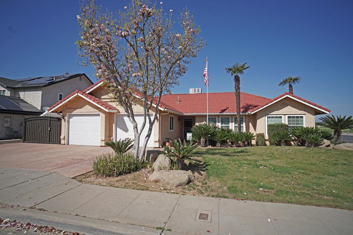 2197 Polson Avenue Clovis, CA 93611 - Photo 1 of 42 a front view of a house with a yard