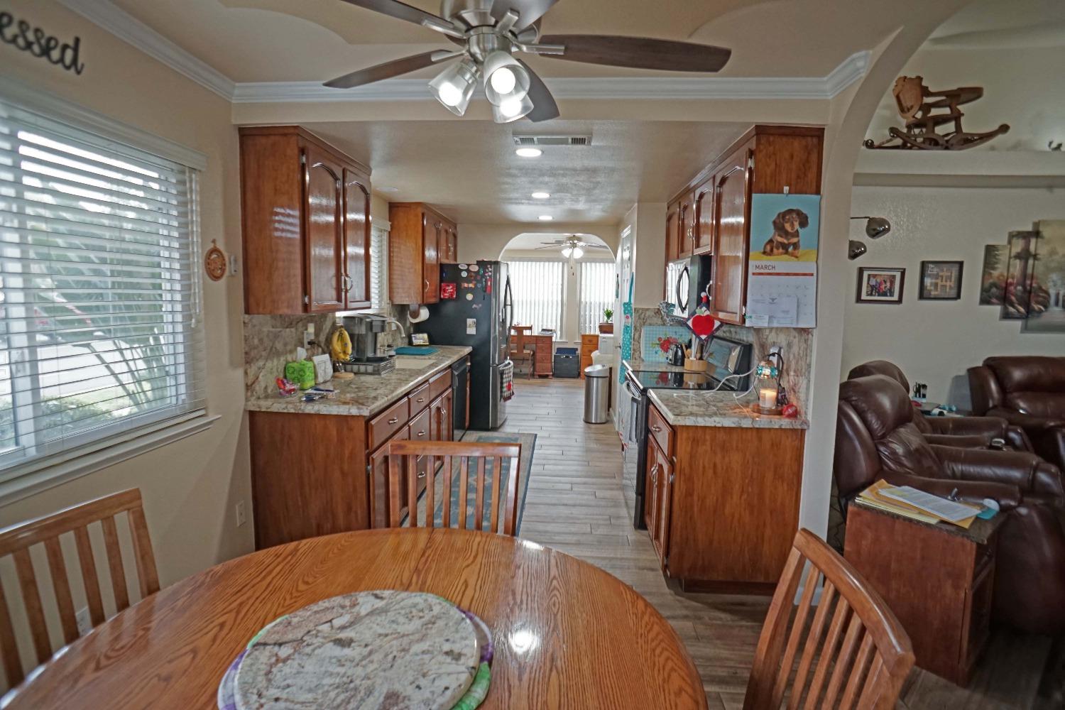 2197 Polson Avenue Clovis, CA 93611 - Photo 13 of 42 a view of a dining room with furniture window and wooden floor
