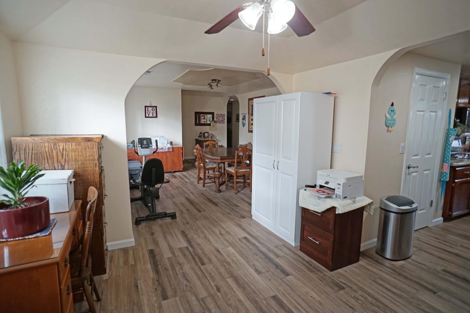 2197 Polson Avenue Clovis, CA 93611 - Photo 14 of 42 a living room with furniture a table and wooden floor
